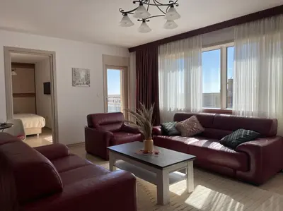 a living room with a couch and a table at DimaX Apartments in Budva