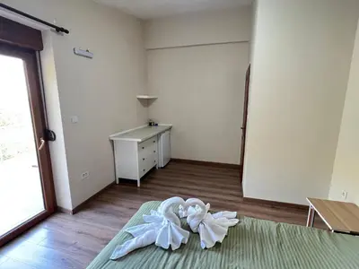 a room with a bed with white towels on the floor at Eco Villa Buljarica in Buljarica