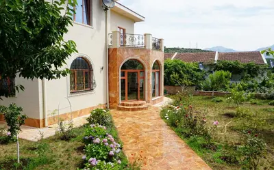 an external view of a house with a garden at Villa Lux Radovici in Radovići