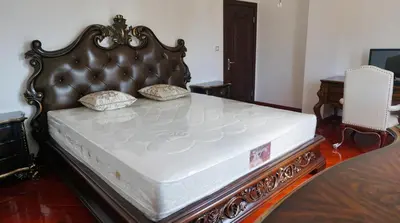 a bed in a room with a large mattress at Villa Lux Radovici in Radovići