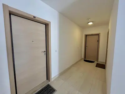 an empty hallway with a sliding door in a building at Plaza Apartment in Budva