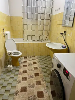 a bathroom with a toilet and a sink at Family Sea View Ulcinj in Ulcinj