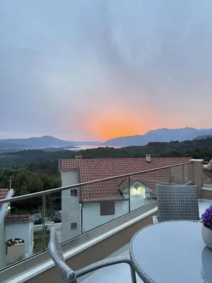a view from a balcony with a table and chairs at Teodora Apartment in Kotor