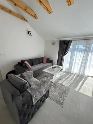 a living room with a couch and a table at Teodora Apartment in Kotor