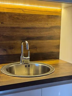 a stainless steel sink in a kitchen counter at Airport apartments Jelena in Podgorica