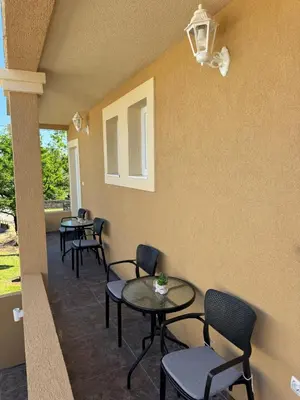 a row of tables and chairs in a waiting room at Airport apartments Jelena in Podgorica