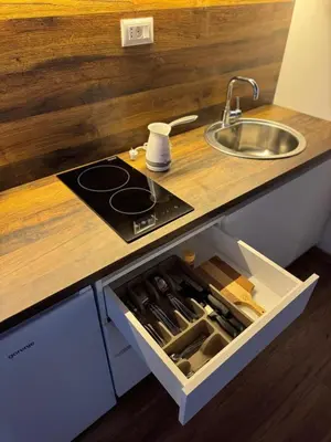 a kitchen counter with a sink and a drawer at Airport apartments Jelena in Podgorica