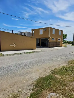 a building on the side of a road at Airport apartments Jelena in Podgorica