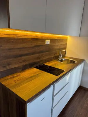a kitchen with a sink and a counter top at Airport apartments Jelena in Podgorica