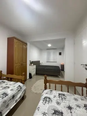 a bedroom with a bed and a couch at Kuća in Ulcinj