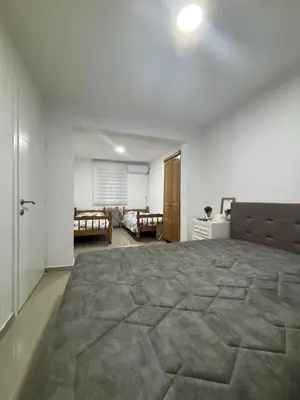 a bedroom with a large bed in a room at Kuća in Ulcinj