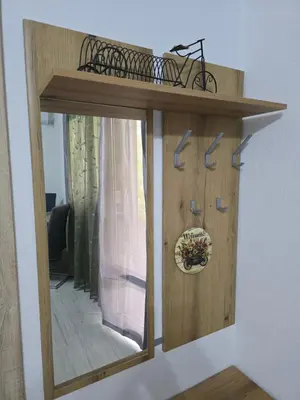 a mirror on a wall with a bike on top at Apartman Jelena in Kotor