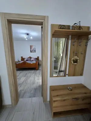 a room with a mirror and a room with a bed at Apartman Jelena in Kotor