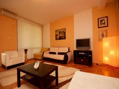 a living room with a couch and a tv at Apartment Susanj in Bar