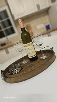 a bottle of wine and two glasses on a tray at LU House in Virpazar