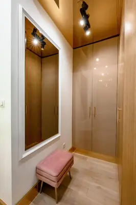 a dressing room with a pink stool and a mirror at URBAN-Soho City Complex in Bar