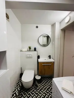 a bathroom with a toilet and a sink at 2 Charming Apartment in Kotor Old Town in Kotor
