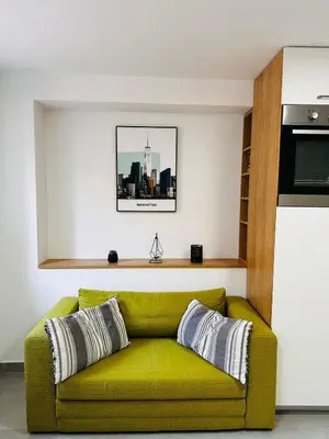 a yellow couch sitting in a living room at 2 Charming Apartment in Kotor Old Town in Kotor