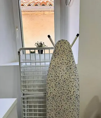 a towel hanging on a rack in a kitchen at 2 Charming Apartment in Kotor Old Town in Kotor