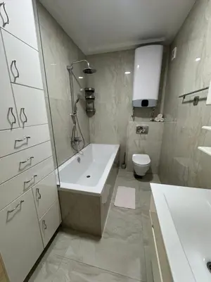 a bathroom with a tub and a sink and a toilet at Lux Apartment 14 in Kravlja