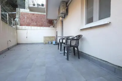 a group of chairs sitting at a table on a patio at Status-M Apartments Seoce17 in Budva