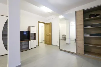 a living room with a large mirrored wall at Status-M Apartments Seoce17 in Budva