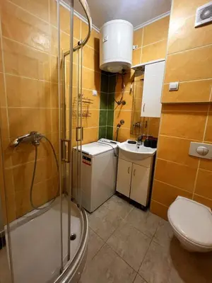 a bathroom with a shower and a toilet and a sink at Status-M Apartments Seoce17 in Budva