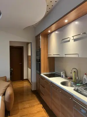 a kitchen with a sink and a counter top at Step to the sea apartment in Rafailovici