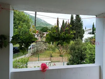 a window with a view of a city at Apartment M2 Pine tree Sutomore in Sutomore