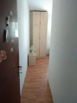 a hallway with a door and a room with a cabinet at Apartment M2 Pine tree Sutomore in Sutomore