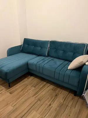 a blue couch sitting in a living room at Villa House Ilda in Bar