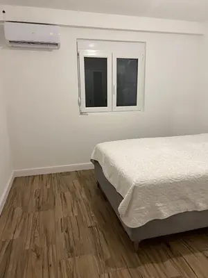 a white room with a bed and a window at Villa House Ilda in Bar