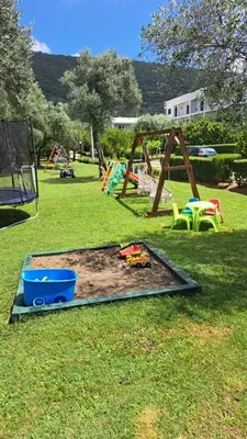 a park with a playground with a sandbox at Apartments Pepdjonovic in Ulcinj