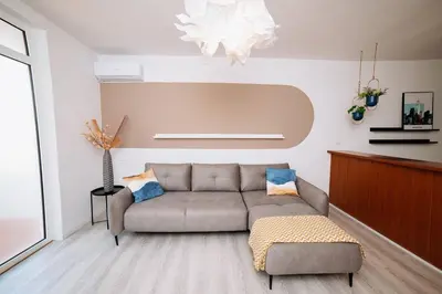 a living room with a couch and a table at Apartment Sveti Stefan in Sveti Stefan