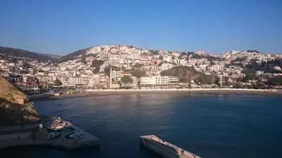 a view of a beach with a town on a hill at Ulcinj Vibes & Waves Apartment in Ulcinj