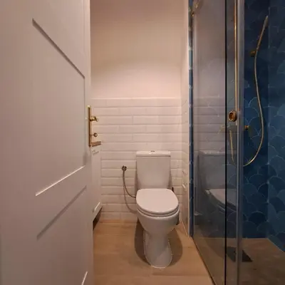 a bathroom with a toilet and a glass shower at Apartment Shell in Budva