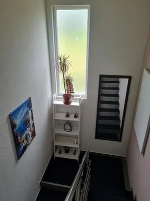 a staircase with a window and a plant on it at Villa Passaggio Private Pool & Tranquil Stay Near the Sea in Bar