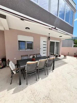a patio with a black table and chairs at Villa Passaggio Private Pool & Tranquil Stay Near the Sea in Bar