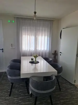 a room with a table and some blue chairs at Villa Passaggio Private Pool & Tranquil Stay Near the Sea in Bar
