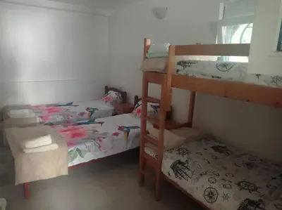 a room with two bunk beds and a bed at Apartman Rogonjić in Sutomore
