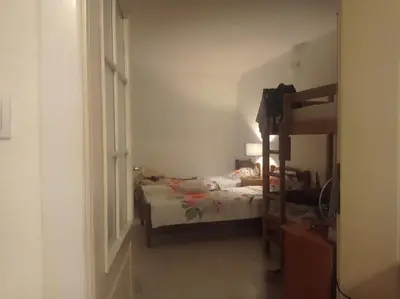 a bedroom with a bed and a bunk bed at Apartman Rogonjić in Sutomore