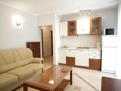 a living room with a couch and a table at Apartment Olea in Becici