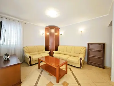 a living room with two chairs and a coffee table at Apartment Olea in Becici