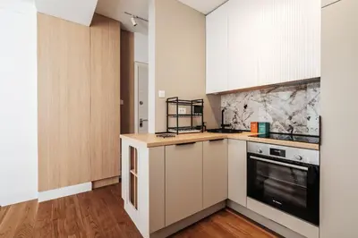 a kitchen with white cabinets and a stove at Przno Gate 114 By In Propety in Pržno