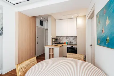 a kitchen and dining room with a table and chairs at Przno Gate 114 By In Propety in Pržno