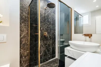 a bathroom with a shower and a sink at Przno Gate 114 By In Propety in Pržno