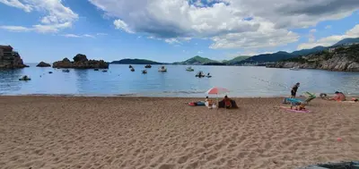 a group of people on a beach near the water at Inspired by Nature in Podličak