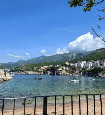 a view of a body of water with boats in it at Azure Horizon Pržno in Sveti Stefan