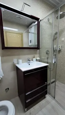a bathroom with a sink and a shower at Azure Horizon Pržno in Sveti Stefan