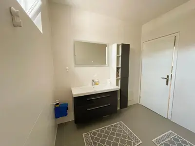 a bathroom with a sink and a mirror at Belvedere Apartments in Ulcinj